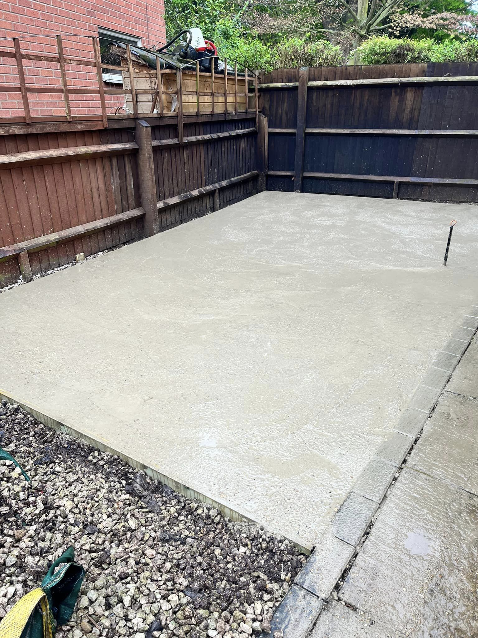 Large concrete base setting in domestic back garden