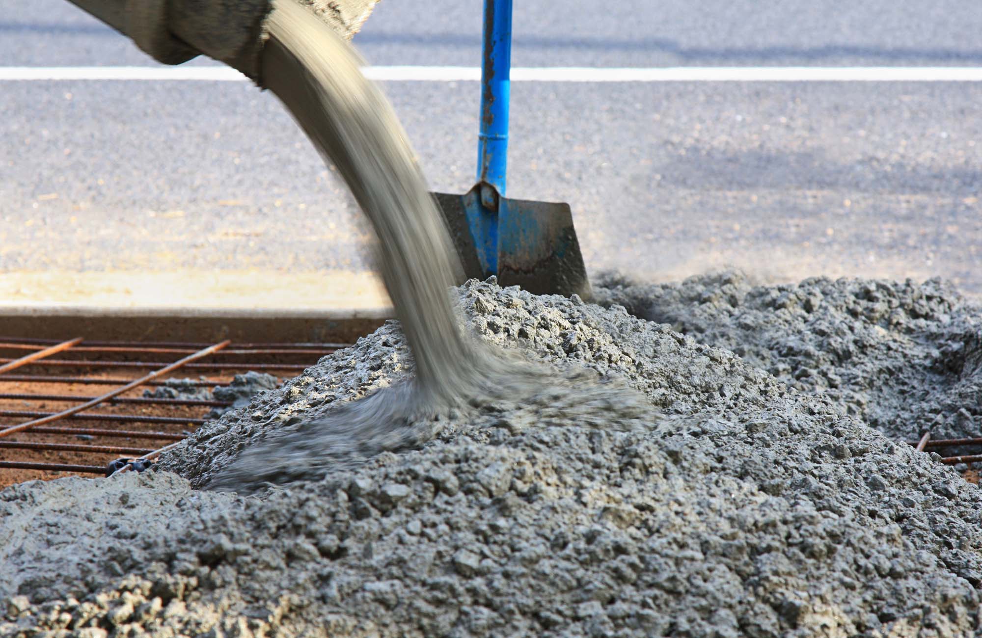 Pouring concrete for a new driveway near the road