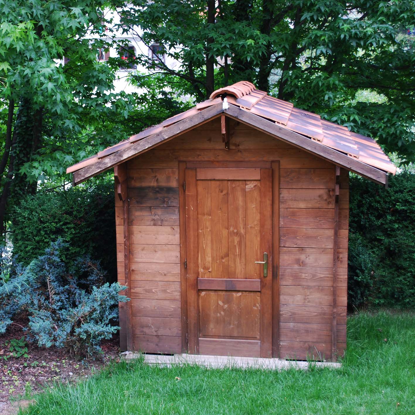 Wooden garden tool shed in a beautiful park