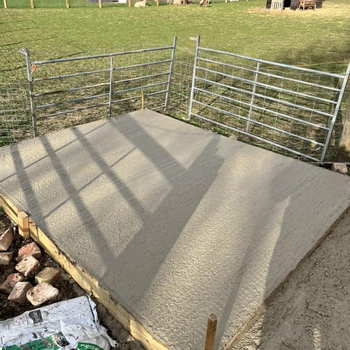 Square concrete base at farm