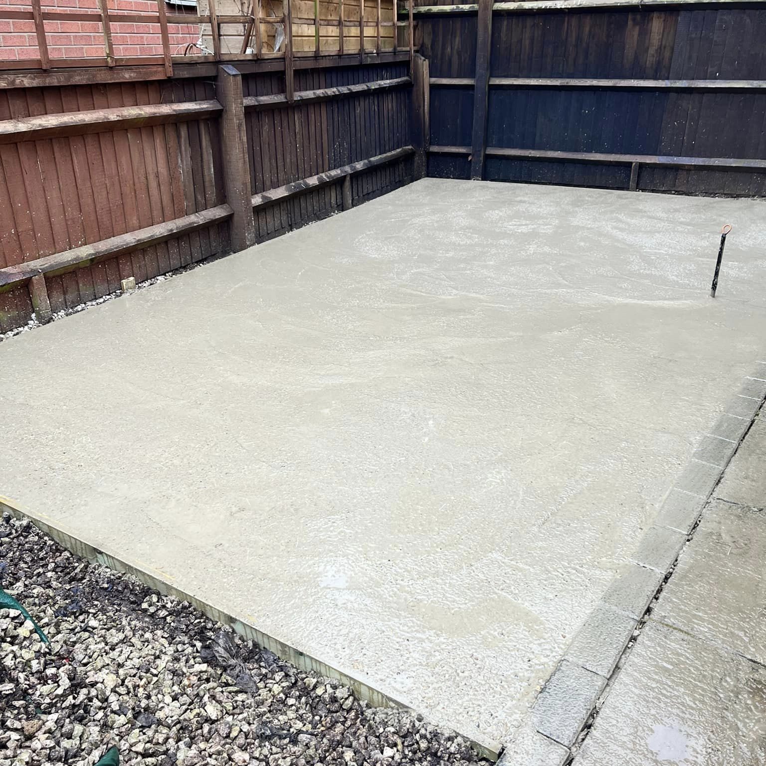 Large concrete base setting in domestic back garden